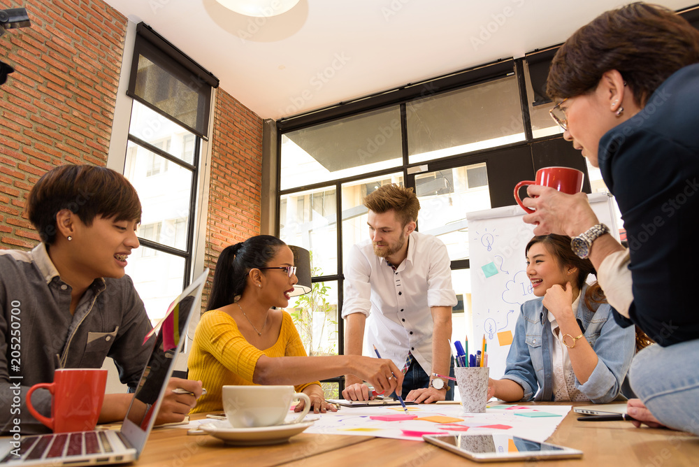 Multi ethnic business person group in casual suit discuss about internal meeting project in modern office. Project and Business concept. Multi ethnic business person group in casual suit discuss about internal meeting project in modern office. Project and Business concept.