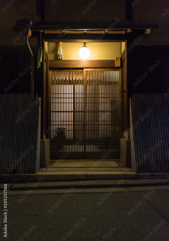 Obraz premium Traditional Japanese house at night, entrance door