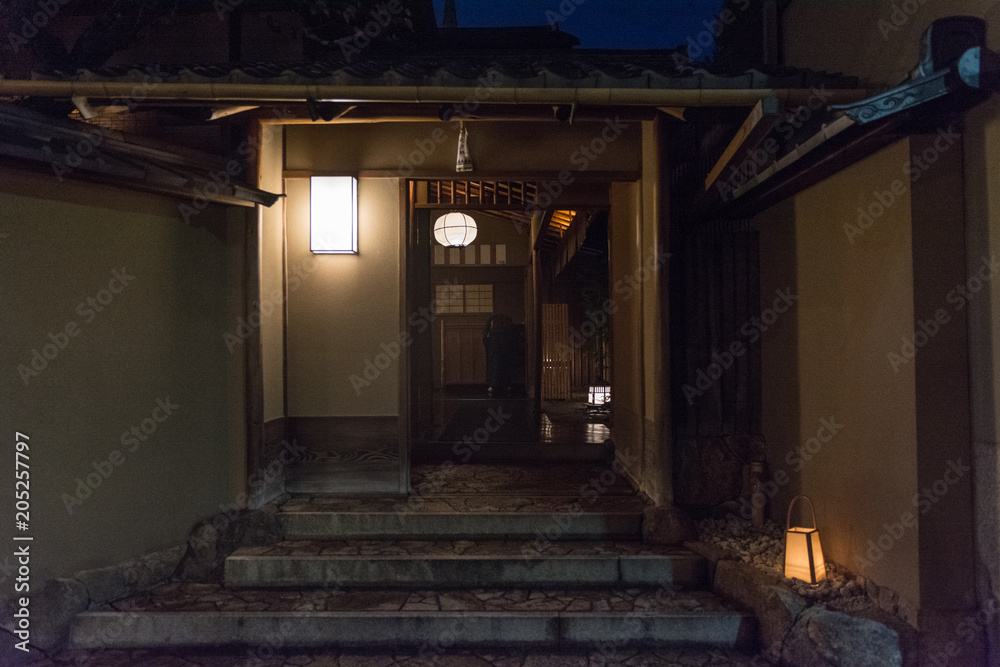 Traditional Japanese house at night, entrance door Traditional Japanese house at night, entrance door