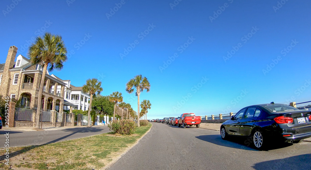 CHARLESTON, SC - APRIL 7, 2018: City oceanfront with tourists on a sunny day. The city attracts 10 million tourists annually