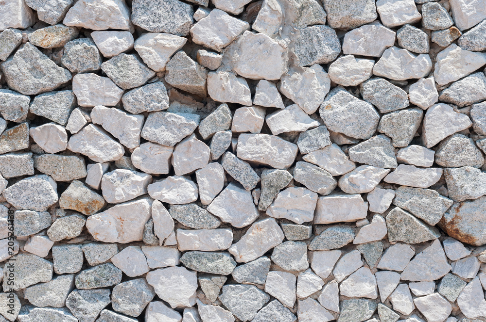 White big rocks stacking to the wall, background pattern and texture. White big rocks stacking to the wall, background pattern and texture.