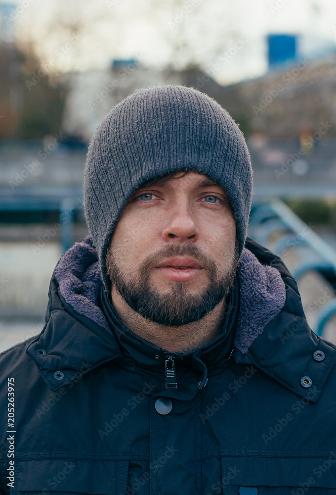 Man model with beard in London city in black jacket Man model with beard in London city in black jacket