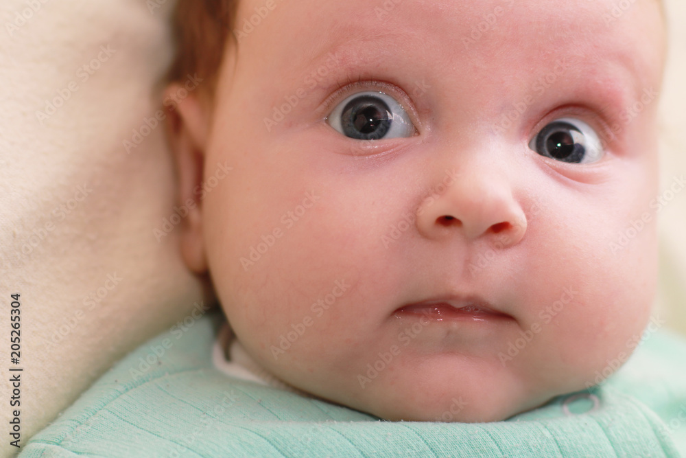 Face of the baby of the girl closeup. Cute newborn baby girl. Face of the baby of the girl closeup. Cute newborn baby girl.