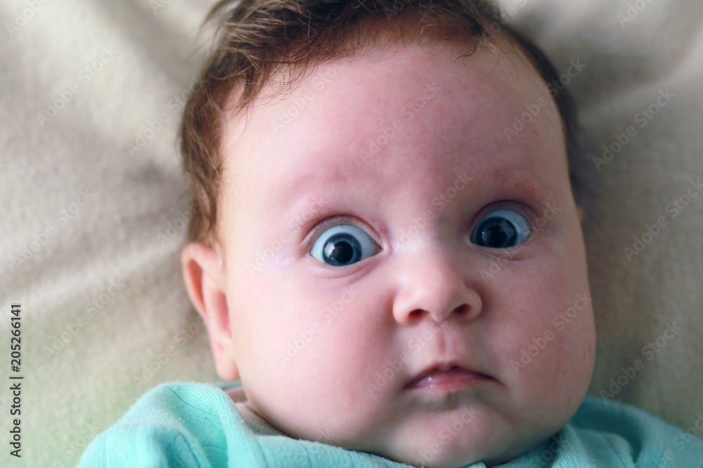Face of the baby of the girl closeup. Cute newborn baby girl. Face of the baby of the girl closeup. Cute newborn baby girl.