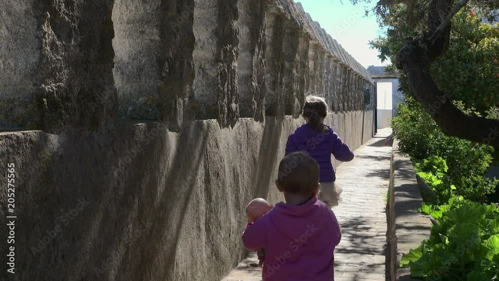 Lockdown: Two Kids Walking on a Small Path in Spain Lockdown: Two Kids Walking on a Small Path in Spain