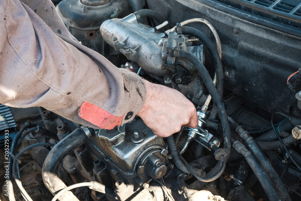 car mechanic repairs the car car mechanic repairs the car