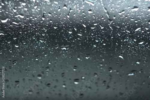 Water drops on glass. The window In rainy weather. Closeup. 