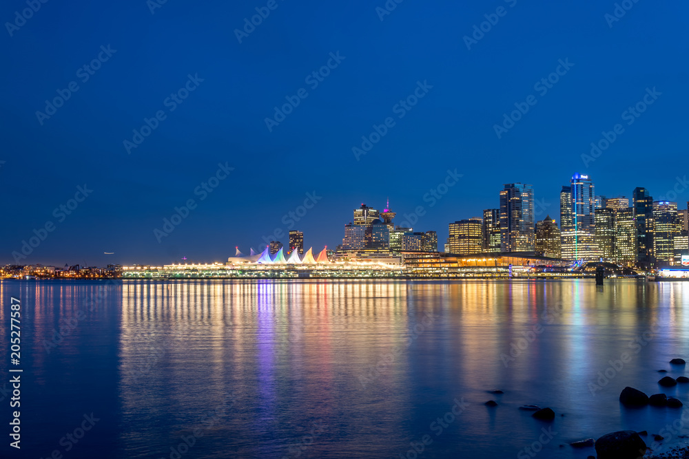 Skyline and Canada Place in Vancouver at nightfall in blue hour