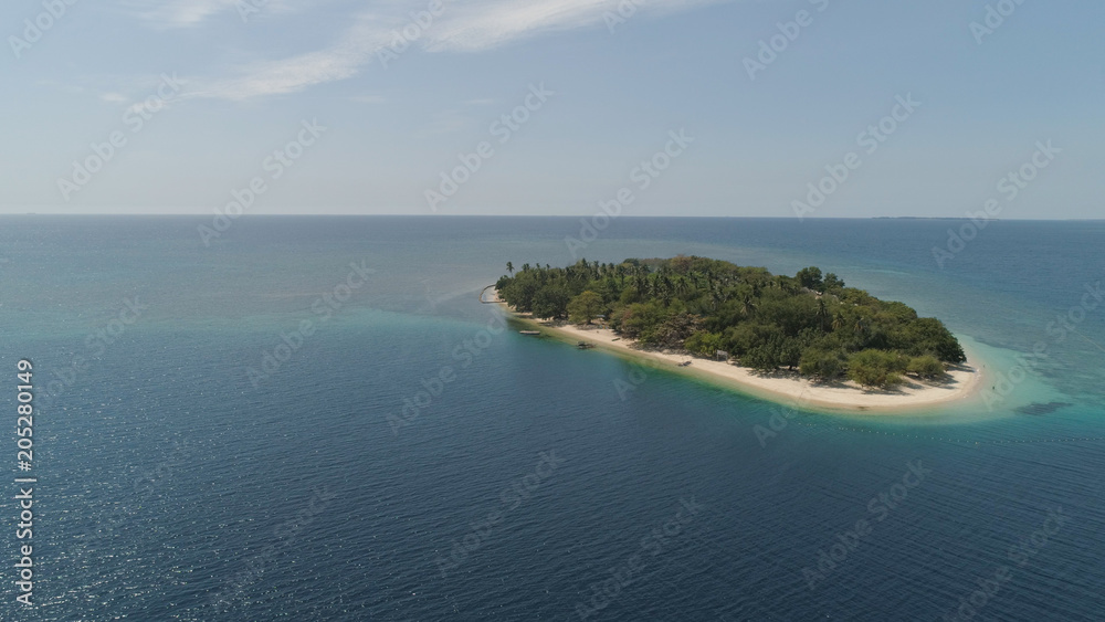 Fototapeta premium Tropical island with white sandy beach. Aerial view: Putipot island with colorful reef. Seascape, ocean and beautiful beach paradise. Philippines,Luzon. Travel concept.