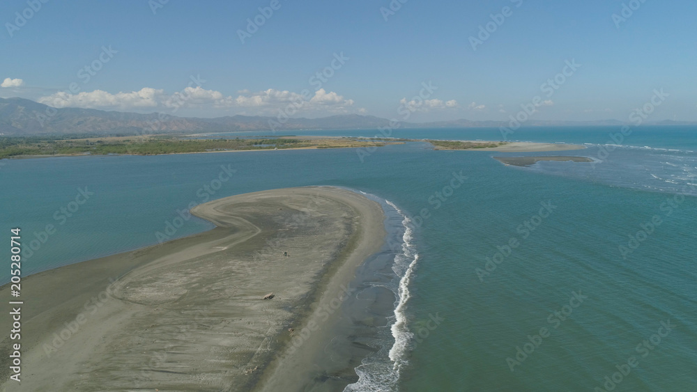 Aerial view of sandy beach Lingayen with azure water on the island Luzon, Philippines. Seascape, ocean and beautiful beach.