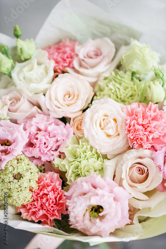 flower arrangement. multicolor bouquet of beautiful flowers on wooden table. Floristry concept. Spring colors. Vertical photo
