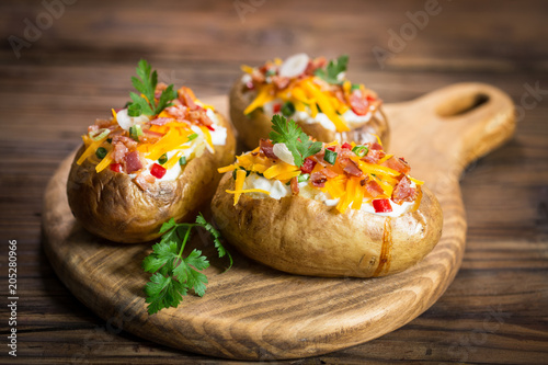 Photography Baked potatoes with cheese and bacon