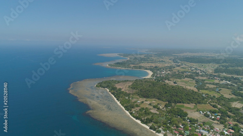 Aerial view of seashore with beaches, lagoons and coral reefs. Philippines, Luzon. Coast ocean with turquoise water. Tropical landscape in Asia. © Alex Traveler