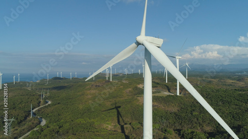 Aerial view of Windmills for electric power production on the seashore. Bangui Windmills in Ilocos Norte, Philippines. Ecological landscape: Windmills, sea, mountains. Pagudpud