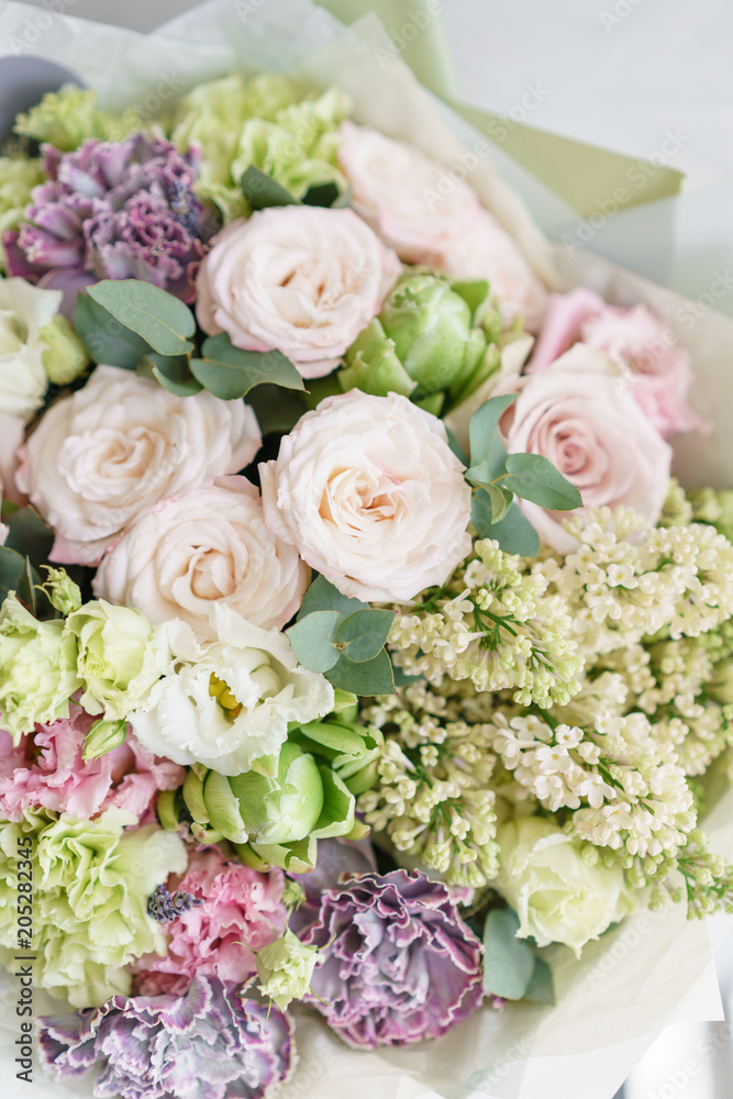 flower arrangement. multicolor bouquet of beautiful flowers on wooden table. Floristry concept. Spring colors. Vertical photo flower arrangement. multicolor bouquet of beautiful flowers on wooden table. Floristry concept. Spring colors. Vertical photo