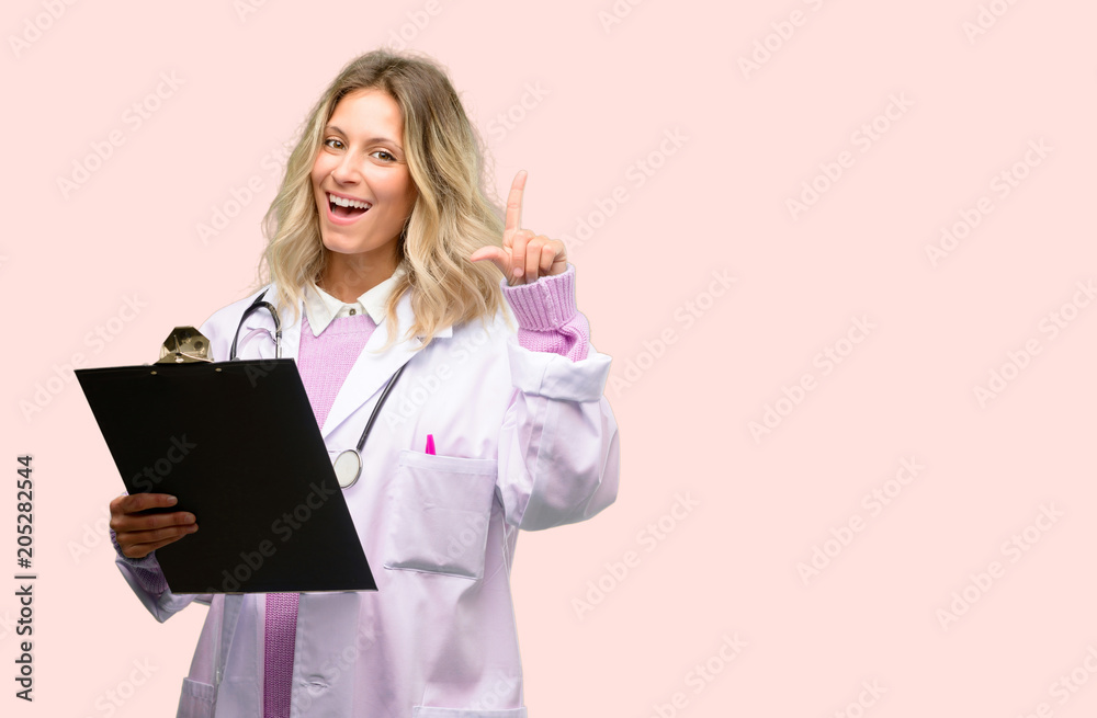 Young doctor woman, medical professional pointing away side with finger Young doctor woman, medical professional pointing away side with finger