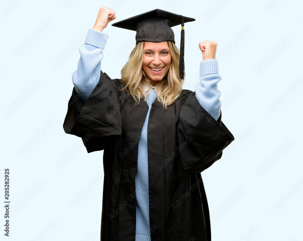 Young graduate woman happy and excited celebrating victory expressing big success, power, energy and positive emotions. Celebrates new job joyful Young graduate woman happy and excited celebrating victory expressing big success, power, energy and positive emotions. Celebrates new job joyful