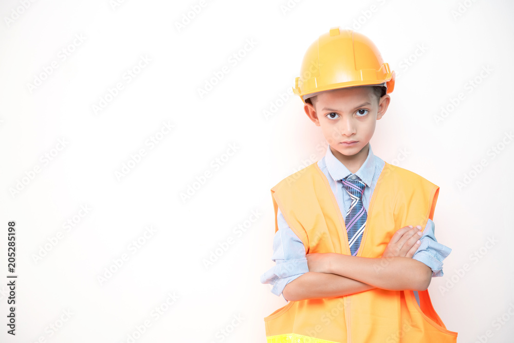 Young boy engineer isolated in white. Handsome early teenage boy portrait with engineering cloth. Confident look pose. Young boy engineer isolated in white. Handsome early teenage boy portrait with engineering cloth. Confident look pose.