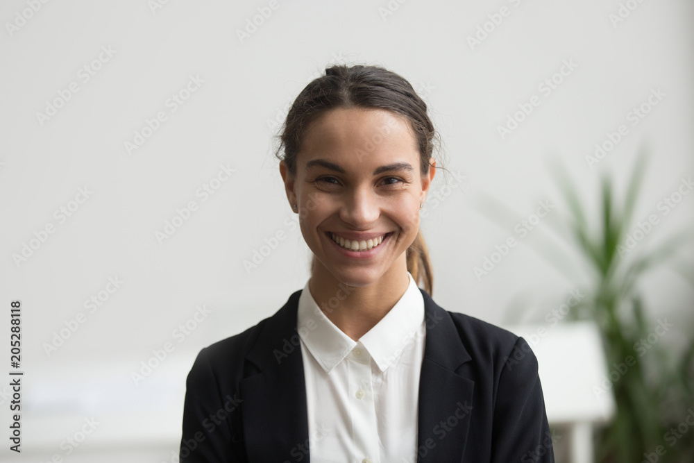 Portrait of happy businesswoman in formal wear smiling to camera in office workplace, posing for company catalogue, business photoshoot. Concept of leadership, confidence Portrait of happy businesswoman in formal wear smiling to camera in office workplace, posing for company catalogue, business photoshoot. Concept of leadership, confidence