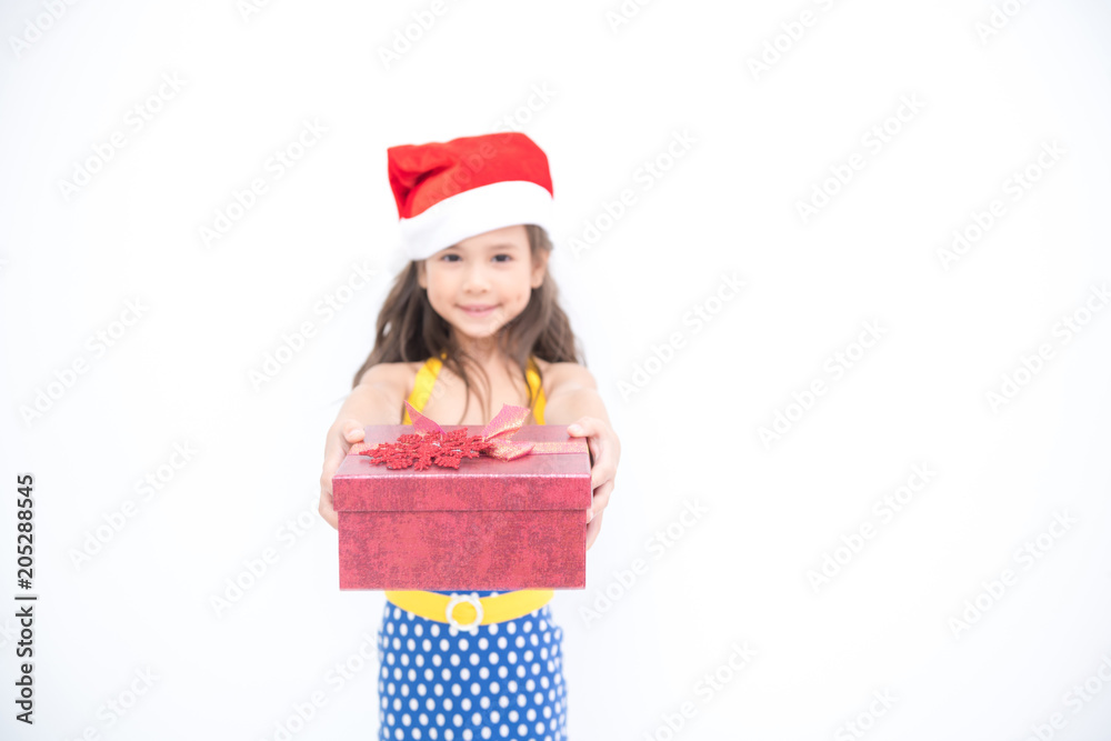 Young girl give suprise gift. Young cute white girl giving a gift present box, looking cute. Isolated in white. Birthday and family concept. Young girl give suprise gift. Young cute white girl giving a gift present box, looking cute. Isolated in white. Birthday and family concept.