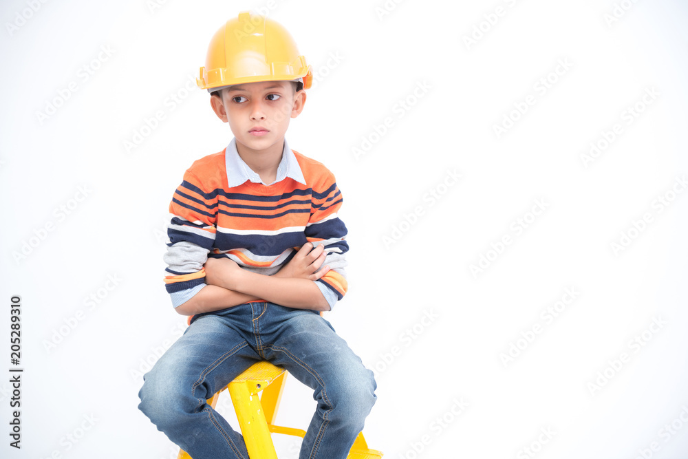 Young boy engineer isolated in white. Handsome early teenage boy portrait with engineering cloth. Confident look pose.