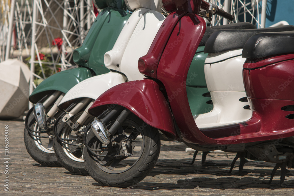 three mopeds painted in colors of the Italian flag three mopeds painted in colors of the Italian flag