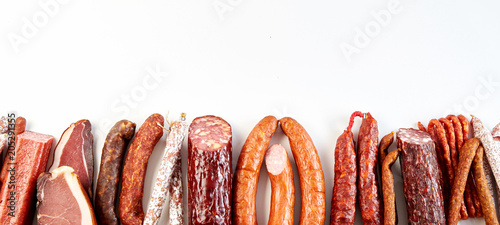 Obraz na płótnie Panorama banner with a diversity of spicy sausages