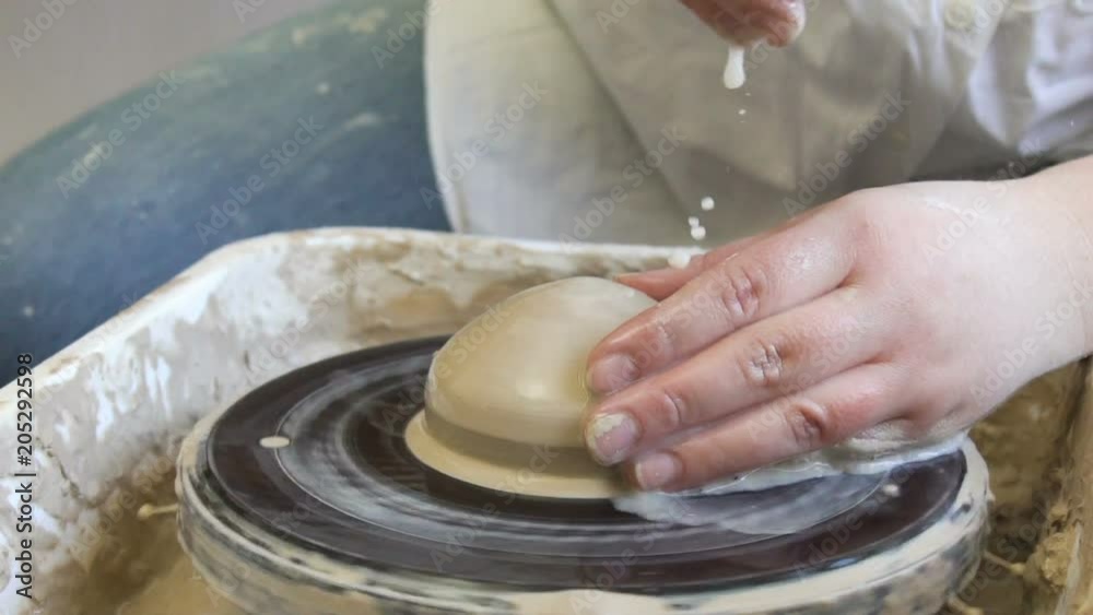 handmade hobby pottery courses. master class at workshop. potter shaping clay on turning wheel handmade hobby pottery courses. master class at workshop. potter shaping clay on turning wheel