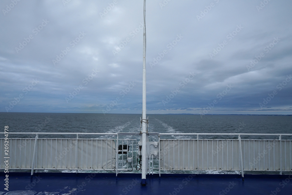 Ferry boat in the sea, back view, day time. Ferry boat in the sea, back view, day time.