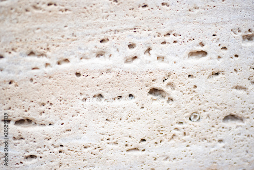 Εκτύπωση καμβά White porous textured tuff. Smooth cut of stone. Close up.