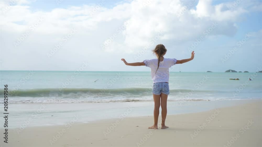 Adorable little girl on the beach on caribbean island. Adorable little girl on the beach on caribbean island.