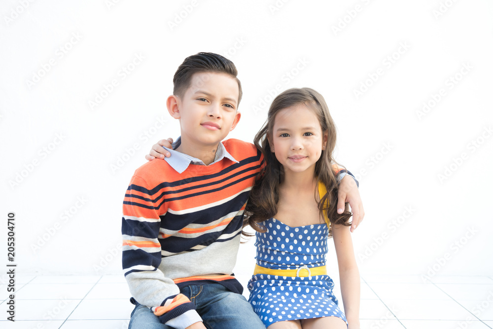 Young brother and sister portrait. Pre teen boy and girl together. Happy smile pose. Outdoor take. Young brother and sister portrait. Pre teen boy and girl together. Happy smile pose. Outdoor take.