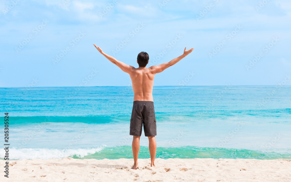 Happy man on beautiful white sand beach Happy man on beautiful white sand beach