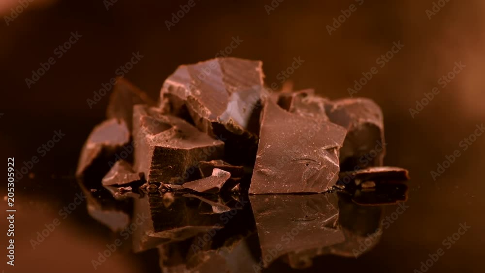 Chocolate. Chunks of sweet dark chocolate rotated closeup. Dessert ingredient. Confectionery. Slow motion 4K UHD video 3840X2160 Chocolate. Chunks of sweet dark chocolate rotated closeup. Dessert ingredient. Confectionery. Slow motion 4K UHD video 3840X2160