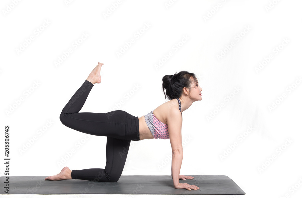 Beautiful woman practicing yoga on a white background.
