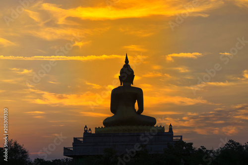 Morning light reflects the Buddha.