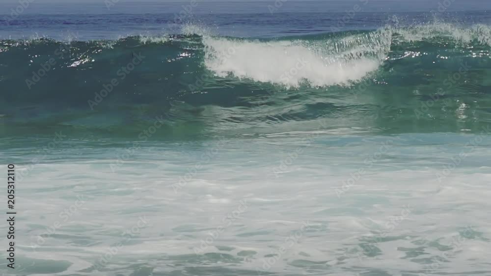 One Big Wave Crashing In Turquoise Clear Ocean Waters In Slow Motion. One Big Wave Crashing In Turquoise Clear Ocean Waters In Slow Motion.