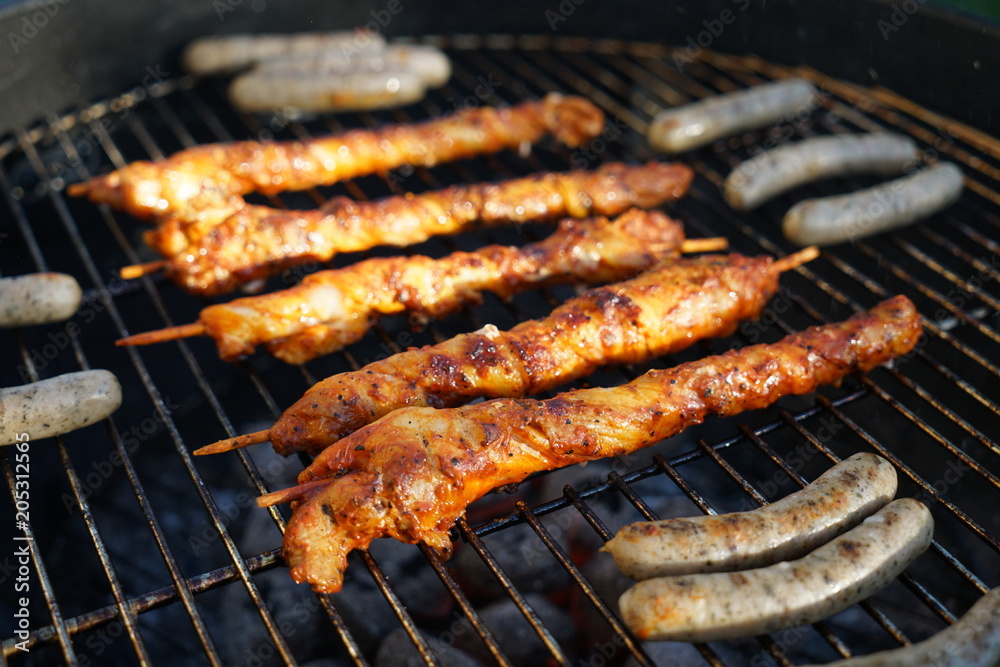 Sausages barbecue with a charcoal barbecue in the garden

