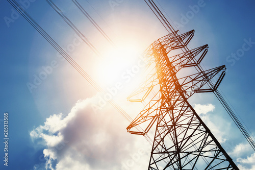 high voltage power and solar energy with blue sky background