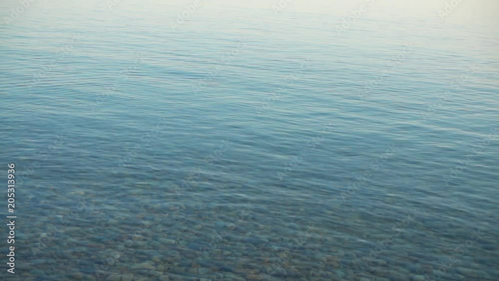 Slowmotion stone skipping on water surface. Slowmotion stone skipping on water surface.