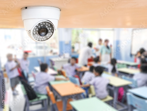 CCTV Security monitoring student in classroom at school.Security camera surveillance for watching and protect group of children while studying.