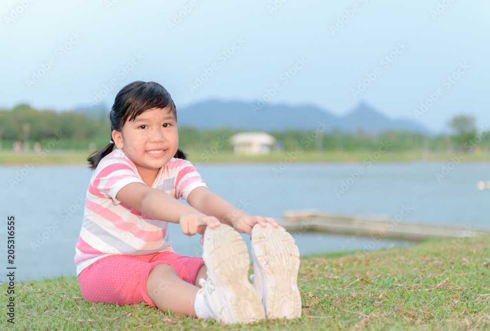 Happy girl exercise at health park Happy girl exercise at health park