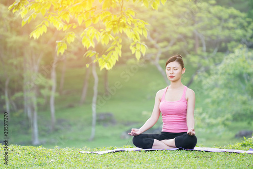 young beautiful asian woman practicing yoga