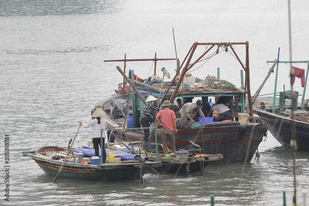 Ha Long Bay , Vietnam-29 November 2014:Fishing boat in Ha long Bay, Panoramic view of sunset in Halong Bay, Vietnam, Southeast Asia,UNESCO World Heritage Site Ha Long Bay , Vietnam-29 November 2014:Fishing boat in Ha long Bay, Panoramic view of sunset in Halong Bay, Vietnam, Southeast Asia,UNESCO World Heritage Site