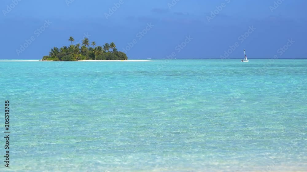 Maldives. Tourists are moving to an uninhabited island on a kayak Maldives. Tourists are moving to an uninhabited island on a kayak