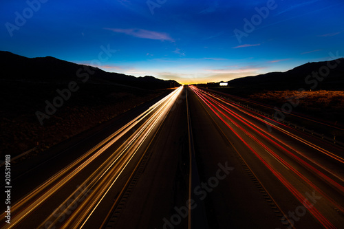 MARCH 12, 2017, LAS VEGAS, NV - streaked lights at sunset over Interstate 15, south of Las Vegas, Nevada at sunset