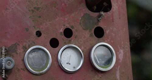 Rusty old tractor guages close up