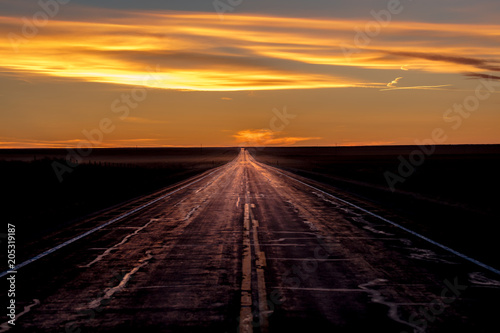 Tablou pe pânză MARCH 8, 2017, NEBRASKA - Sunset over Rural Farm Country Road with pickup truck