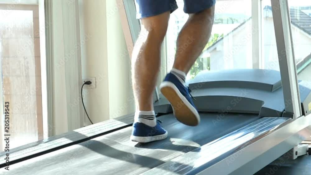 Sport man running on a Treadmill Sport man running on a Treadmill