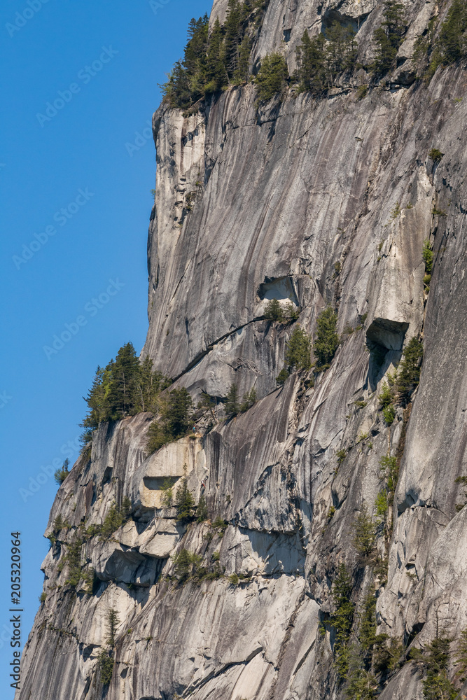 a steep cliff under the blue sky